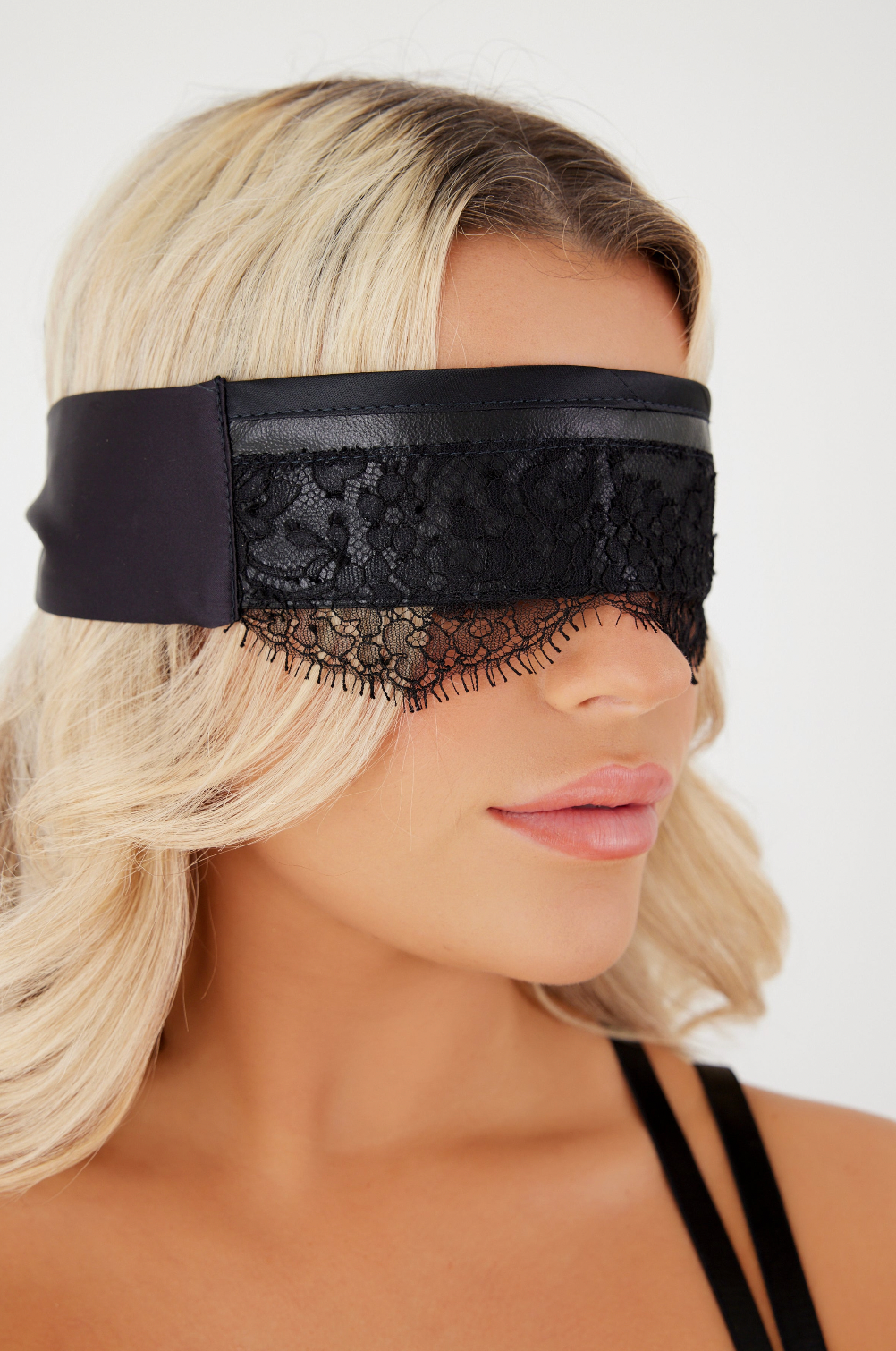 Woman Wearing Leather / Lace Mask from side